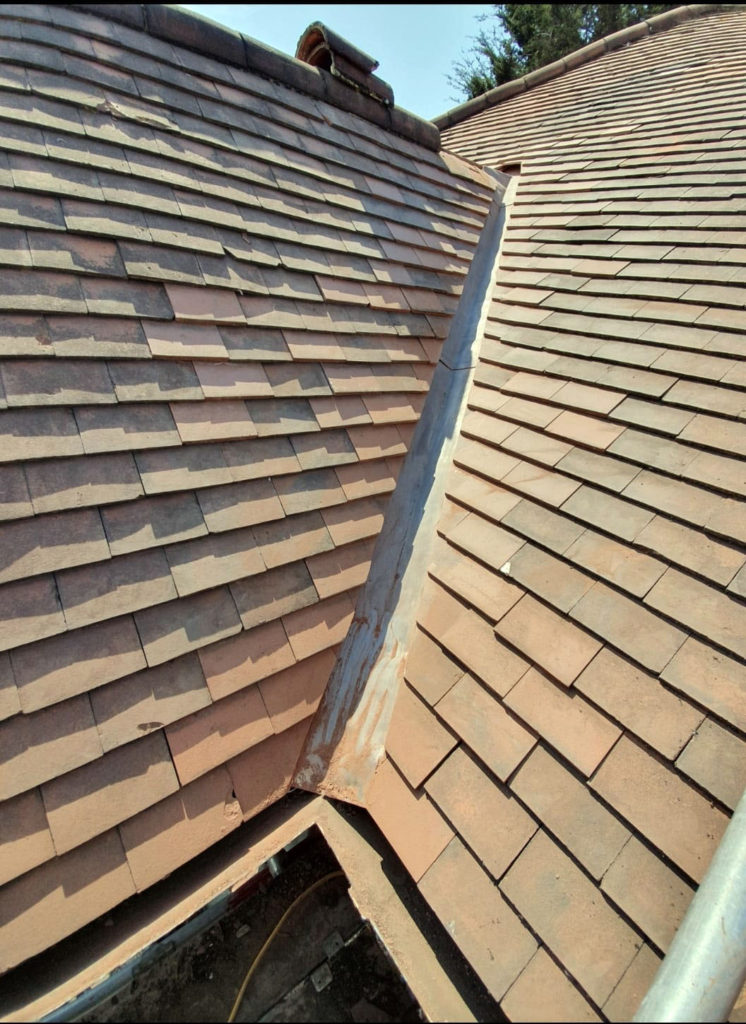 New lead valley on plain tiled roof