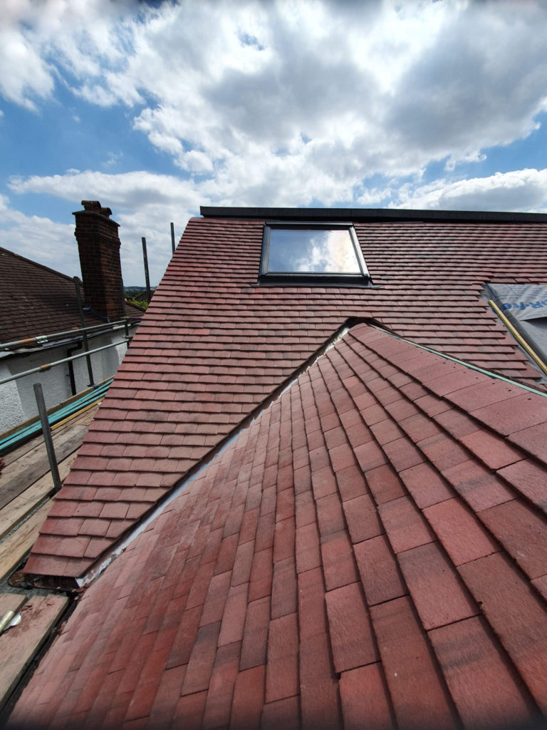 Re-roof in plain tiles