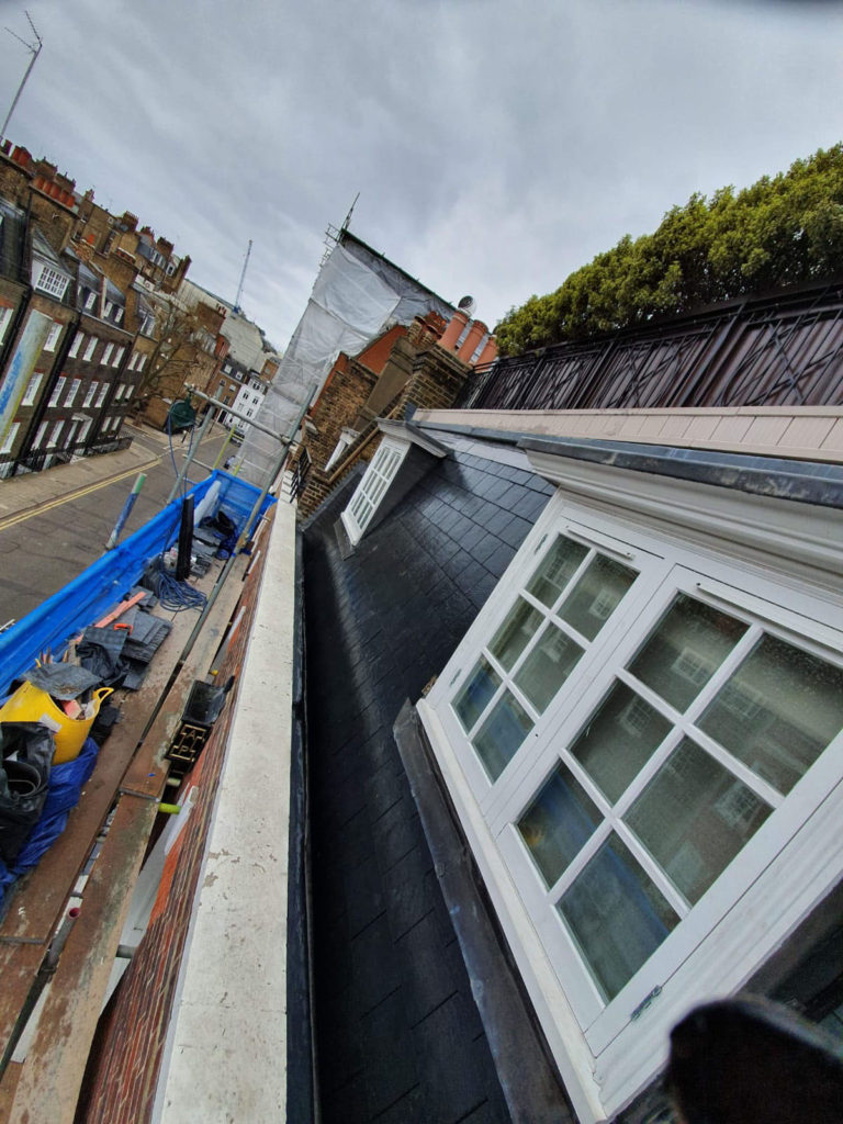 Re-roof in natural slate with lead work